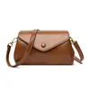Nova bolsa cilíndrica flip-top transfronteiriça para mulheres, simples retrô luxo leve moda versátil grande capacidade bolsa de ombro transversal