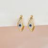 Pendientes de ojo de diablo con clip para la oreja, estilo transfronterizo europeo y americano, con hebilla de circonita azul tinta, para mujer.