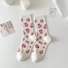 Calcetines rosas de mujer primavera y verano tendencia coreana calcetines simples de tubo Joker calcetines lindos con flores y letras de personalidad al por mayor