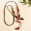 Collar con colgante de campana de mariposa de cerámica de estilo étnico retro para mujer, diseño nuevo y moderno, cadena larga para suéter, accesorios