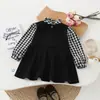 Cross 2026 Primavera Otoño Ropa Infantil Niñas Vestido Falso de Dos Piezas Cuadros Blanco y Negro Manga Larga Vestido Princesa Ropa Infantil de Comercio Exterior