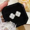 Pendientes de Botón Exquisitos de Moda Estilo Coreano Trébol de Cuatro Hojas con Circonita Pequeña Accesorios para Pendientes de Gama Alta Nicho Pendientes de Aguja Plateada Versátiles para el Temperamento