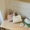 2026 Estilo francés fresco y elegante lazo verano nuevo gran capacidad color sólido moda hombro bandolera bolso para mujer