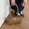 Bolso de hombro de gamuza 2026 para ir al trabajo, estilo vintage, para mujer, otoño, gran capacidad, versátil, nicho, moda nueva, bolso de axila de gamuza