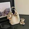 Bolso tipo cubo de alta gama para mujer, nuevo y moderno otoño 2026, bolso tote pequeño para trabajo y uso diario, bolso cruzado de un solo hombro para commuting