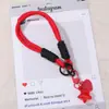 Alça de celular de laço duplo, chaveiro de estrela, etiqueta em formato de coração, cores suaves, design cheio e fofo, simples, portátil, versátil