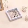 Stock listo Caja de suspensión de película de PE al por mayor Caja de joyería Caja de almacenamiento para collares, pulseras y anillos Caja de joyería transparente