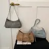 Bolsa de ombro moderna e estilosa, bolsa baguette casual e texturizada, nova coleção 2026, bolsa de ombro fashion e versátil, bolsa transversal feminina