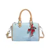 Bolsas de mujer de nicho de lujo ligero 2026 nuevo súper popular bolso tote de mezclilla bolso Boston tipo almohada bolso de hombro cruzado