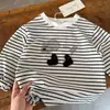 Nueva camiseta de manga larga de primavera y otoño 2026 para niños y niñas, con un diseño de cachorro a rayas de dibujos animados en 3D