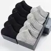 Calcetines empaquetados individualmente calcetines de media pantorrilla para hombre otoño e invierno absorbentes de sudor transpirables calcetines de media pantorrilla para hombre de negocios color liso antiolor Zhuji