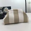 Bolsa de punto para Dropshipping Transfronterizo Bolso de mano rayado para mujer Tejido Fly-Knit Nube Versátil Elegante Portátil Bolsa de maquillaje Gran capacidad