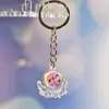 Nuevo Colgante Creativo de Bolsa con Cara Sonriente de Pulpo Brillante Dibujo Animado Pequeño Regalo Llavero de Moda Anillo de Llave