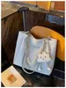 Bolsa de Grande Capacidade Feminina Outono Versátil 2026 Nova Elegante Simples Bolsa de Ombro Texturizada Para Aula Trabalho Bolsa Tote