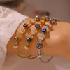 Pulseira Retro Europeia e Americana de Luxo Leve com Pingente Olho do Diabo Óleo Gotas Pulseira de Aço Titânio Banhada a Ouro Verdadeiro 18k Cravejada com Diamante