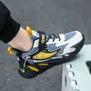 Sapatos esportivos masculinos atacado primavera e outono temporada escolar tênis de corrida crianças médias e grandes malha couro sapatos casuais antiderrapantes resistentes ao desgaste