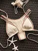 Trajes de baño nuevos 2027 para vacaciones transfronterizas en la playa, trajes de baño tailandeses, bikini de alta gama, en stock