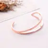 Pulseras Doradas Rosas para Niñas al por Mayor Tendencia Acero de Titanio Metal Abierto Pulseras para Hombres al por Mayor Parejas Manijas para Hombres y Mujeres