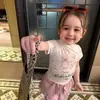 Conjunto de verano nuevo estilo coreano para niñas 2026, camiseta linda para bebés, top versátil, pantalones de pierna ancha con dobladillo de volantes a la moda