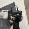 Bolso de mano para mujer, nuevo, simple, de moda, tipo cubo, primavera 2024, nicho, pequeño de alta gama, estilo Chanel, bandolera