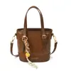 Bolsa de Mão Pequena Retrô Fashion para Mulheres Nova Tendência Primavera 2026 Bolsa Saco com Textura Estilosa Bolsa Pequena Transversal