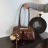 Bolsa de Axila Retrô de Nicho para Mulheres Outono/Inverno 2025 Nova Versátil Tendência Coreana Bolsa de Ombro Bolsa de Bowling de Grande Capacidade