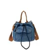 Bolsa Vintage de Jeans Transfronteiriça para Mulheres, Grande Capacidade, Nova Bolsa Versátil de Ombro e Transversal 2026, Adequada para Aula e Deslocamento, Bolsa Saco
