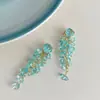 Pendientes de borla de cristal azul frío de verano de alta gama de lujo ligero de diseño de nicho para fotos de viaje pendientes versátiles