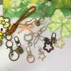 Colección de Accesorios Llavero Frijol Pin Adornos Colgantes Set Completo Paquete de Materiales diy Anillas de Resorte Argollas Abiertas Dijes para Bolsos