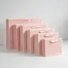 Bolsas de regalo en blanco listas para usar se pueden imprimir con logotipos, bolsas de papel kraft engrosado, bolsas de papel para compras con asa, bolsas de embalaje al por mayor