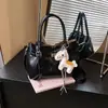Bolso de mano vintage de nicho estilo coreano, nuevo modelo verano 2026, gran capacidad, simple, adecuado para ir al trabajo, bolso tipo cubo de un solo hombro cruzado