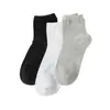 Calcetines Zhuji Primavera y Otoño Color Sólido Blanco y Negro Calcetines Deportivos para Hombres y Mujeres Estudiantes, Transpirables, Absorbentes de Sudor, Resistentes al Olor, Largos y de Longitud Media
