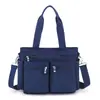 Nova bolsa feminina 2023 casual simples moda portátil bolsa de ombro multifuncional grande capacidade cor sólida fresca bolsa de compras