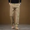 Pantalones de negocios casual de alta gama para hombre de Hong Kong, estilo recto ajustado, nueva colección 2026, versátiles pantalones largos caqui