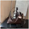 Comercio exterior transfronterizo: Directo de la fábrica de origen, nueva colección 2026 de bolsos cruzados retro, versátiles bolsos estilo dumpling