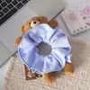 Acessórios de cabelo de urso de pelúcia xadrez estilo coreano, um acessório de cabelo fofo e versátil para meninas, perfeito para estilizar cabelos curtos, e um elástico de cabelo moderno para lavar o rosto