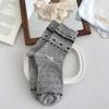 Otoño e invierno nueva ola puntos perrito retro isla ferial amor lazo estilo coreano ins viento barroco calcetines de tubo para mujer