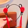 Diadema para el cabello para niños Popular en Internet 2025 Nueva Diadema roja linda de orejas de gato antideslizante para niñas de Año Nuevo