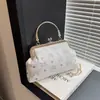 Bolsa de Mão Estilo Doce Nicho Retrô Bolsa de Corrente Feminina Verão 2026 Nova Moda Bolsa Transversal Simples Bolsa Quadrada Pequena