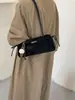 Bolso de axila de nicho estilo francés para mujer, nueva colección otoño/invierno 2026, bolso de hombro casual retro, bolso baguette de alta gama para el trabajo