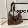 Directo del fabricante: Bolso tote sencillo de estilo coreano para mujer, nuevo bolso tote retro de un solo hombro 2026, bolso cruzado versátil