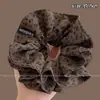 Novo scrunchie de alta qualidade para rabo de cavalo baixo 2026 para mulheres, apresentando um estilo inspirado em Melard, um acessório de cabelo retrô para outono e inverno
