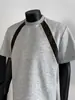 Chegada de Verão 2025 Moda Masculina Marca Estilo Americano Design Solto Senso de Estilo Cinza Adolescente Gola Redonda Manga Curta Roupas da Moda