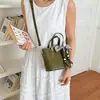 Bolsas Retro de Gama Alta de Nicho para Mujer 2026 Nuevo Otoño Versátil Casual Bolso Cruzado Exquisito Bolso de Mano Tipo Cubo