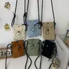 Nova bolsa de celular 2026, lisa, leve e minimalista para mulheres, com fecho de cordão, material de lona e design mini de ombro/transversal, perfeita como uma pequena bolsa de mão