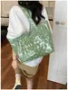 Bolsa de ombro única feminina design de nicho senso de estilo couro macio bolsa feminina grande capacidade para o dia a dia temperamento bolsa tote simples feminina transfronteiriça