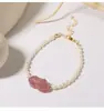 Anillo Pixiu de cristal de fresa y perla de agua dulce tipo grano de arroz, un diseño elegante y moderno para mujer, con banda elástica ajustable