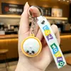 Llavero de moño moderno y popular, colgante de muñeca con emoji lindo, decoración para mochila de estudiante, regalo pequeño, mercancía de puesto callejero
