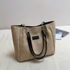 Bolsa de mano de gran capacidad, bolsa de paja para vacaciones, nueva bolsa de hombro de nicho para el día a día, moderna bolsa de playa de verano para mujer