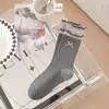 Calcetines Coreanos Dongdaemun Nuevos Primavera y Verano 2026 para Mujer con Lazo 3D, Calcetines a Media Pantorrilla con Etiquetas de Tela de Letras, Calcetines Holgados